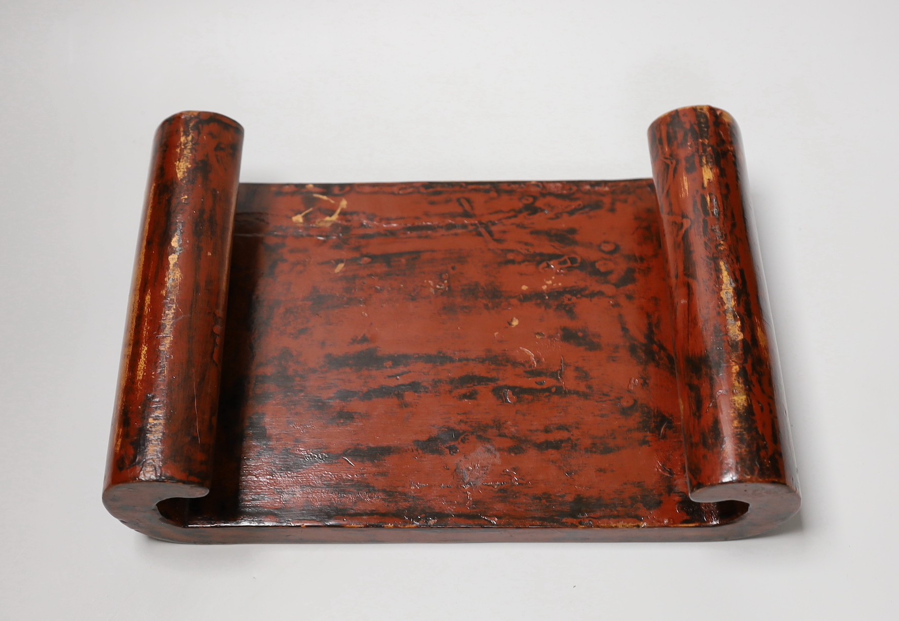 A 19th century Japanese black and red lacquer stand. 32cm wide